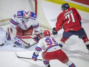 Windsor Spitfires' forward  Josh Currie has his scoring attempt turned aside by Kitchener Rangers' goalie Pavel Cajan on Saturday at the WFCU Centre.