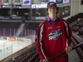 Windsor Spitfires draft pick A.J. Spellacy walked away from five NCAA Division I football scholarship offers to sign with the club on Wednesday.