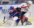 Kitchener Rangers' forward Navrin Mutter is taken out by Windsor Spitfires' defenceman Nathan Ribau during Tuesday game at the Kitchener Memorial Auditorium. David Bebee/Waterloo Region Record.