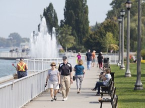 The riverfront pathway near the Peace Fountain at Reaume Park in Windsor is full of walkers on a sunny Friday afternoon, September 25, 2020.