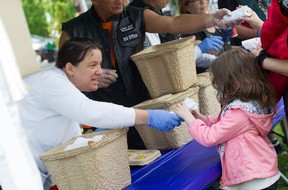 City's birthday bash a hit despite Mayor's Walk washout Members of the Canadian Motorcycle Cruisers, Windsor Chapter, hand out hot dogs on Saturday at a celebration of Windsor's 130th birthday.