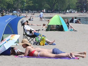 Sun-worshippers enjoy themselves at Woodbine Beach in Toronto on May 29, 2022.