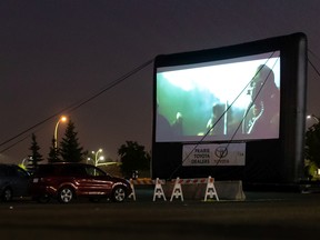 Movie fans watch Star Wars: Rogue One on a 4-storey drive-in movie screen at Southgate Centre in Edmonton, on Wednesday, Sept. 16, 2020.