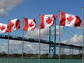 Windsor, Ontario. September 23, 2019. Flags of Remembrance display by Veteran Voices of Canada on the Windsor riverfront near the Ambassador Bridge where 128 flags are flying representing 128,000 Canadian soldiers and RCMP who have died or are missing since the Boer War.