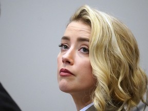 Amber Heard listens in the courtroom at the Fairfax County Circuit Courthouse in Fairfax, Va., Monday, May 23, 2022.