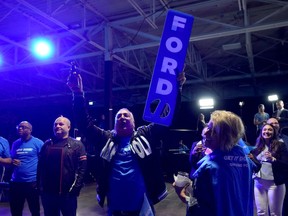 Supporters of Ontario PC Party Leader Doug Ford cheer as early results trickle in for the Ontario provincial election, in Toronto, Thursday, June 2, 2022. THE CANADIAN PRESS/Nathan Denette