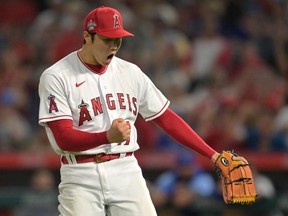 Los Angeles Angels starting pitcher Shohei Ohtani reacts after the final out of the eighth inning of the game against the Kansas City Royals at Angel Stadium.
