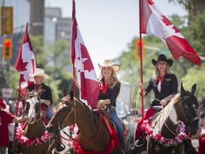 Windsor's Canada Day parade returns after a two-year hiatus. Food banks are asking spectators to bring along a can or other donation to help fill shelves. In this July 1, 2019, photo, riders with the Sarah Parks Horsemanship make their way down Ouellette Avenue during the most recent national day parade.