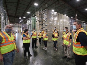 Visitors tour a section of the Diageo Canada bottling plant in Amherstburg on Friday, June 3, 2022.