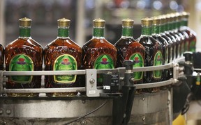 Crown Royal bottles are shown heading for shipping at the Diageo Canada bottling plant in Amherstburg on Friday.