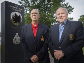 Soldier support. Dave Woodall, left, and Glenn Stannard, civilian volunteers with Delta Company and supporters of The Essex and Kent Scottish Regiment, are pictured at Dieppe Park, on Monday, June 13, 2022.