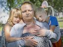 Windsor has become expensive for those seeking affordable rents. Michelle Potter, is shown Friday, June 17, 2022, with her children, David, 6, and Hope, 5,  in Kinsmen Park across from Hiatus House where they are currently staying.