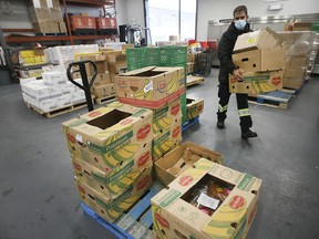 WINDSOR, ONTARIO. OCTOBER 29, 2021 - Mohamed Chreif, a volunteer at the Unemployed Help Centre of Windsor is shown in the food bank area of the organization on Friday, October 29, 2021.
