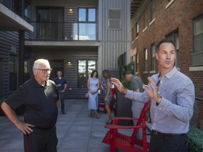 Developer Brent Klundert, of BK Cornerstone Design-Build Ltd., provides a tour of The Hive in downtown Windsor during a grand opening ceremony on Thursday. Pictured here is the common rooftop space overlooking Pelissier Street and the Windsor skyline.