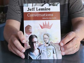 University of Windsor professor Dale Jacobs holds a copy of Jeff Lemire: Conversations, published by University Press of Mississippi.