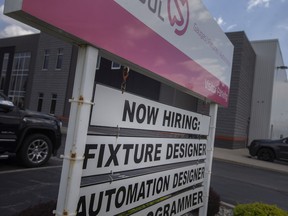 A 'Now Hiring' sign is seen outside Select Tool on North Talbot Road, in Tecumseh on Wednesday, June 29, 2022.