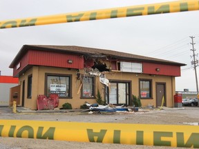 The damage to a building at 256 Talbot St. W. is shown Oct. 23, 2012, in Leamington. Two men were rushed to hospital with life threatening injuries after the truck they were travelling in at a high rate of speed launched into the air and struck the building. (DAN JANISSE/Windsor Star)