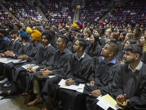 St. Clair College graduates attend an in-person convocation session at the WFCU Centre on June 8, 2022.