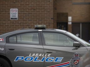 A Lasalle police cruiser patrols around Sandwich Secondary School on June 14, 2022.