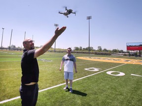 St. Clair College will be launching a new drone course this September in the journalism and media convergence programs and next year in the PR program. Drone instructor Shaher Batroukh, left, gives Tyler Clapp, an incoming media convergence student a demonstration during a press conference at the main campus on Tuesday, June 21, 2022.