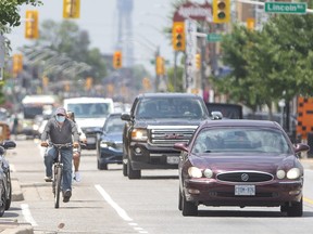 Cyclists make their way east amid vehicle traffic on Wyandotte Street East in Walkerville on Wednesday, June 29, 2022.
