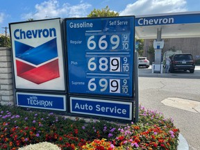 FILE PHOTO: Gas prices are advertised at a Chevron station as rising inflation and oil costs affect the consumers in Los Angeles, California, U.S., June 13, 2022.