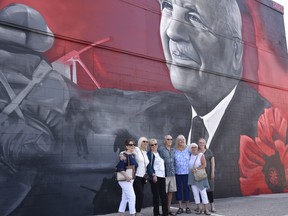 Family members of Colonel Paul Poisson, the town's first mayor and a First World War veteran, celebrated the unveiling of a mural featuring Poisson at Royal Canadian Legion Branch 261 in honour of the town's 100th anniversary on Sunday, July 3, 2022.
