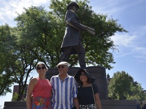 Mark Williams (centre) and Laura Williams (right), the artists who created the statue of Hiram Walker now located at Riverside Drive and Devonshire Road, pictured with daughter Jaime Speaker (left) at the statue's unveiling on July 2, 2022.