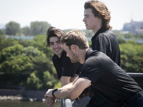 Top would-be picks for the upcoming 2022 NHL draft, stand look at the scenes at the Old Port on Wednesday July 6, 2022. Conor Geekie, (L), Shane Wright (C) and Matthew Savoie (standing upright).
