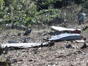 This picture taken Sunday, July 17, 2022, shows debris on the crash site of an Antonov An-12 cargo aircraft a few kilometres away from the city of Kavala in Greece.