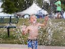 Lucas Sinclair, an attendee of the 2017 edition of the Belle River Sunsplash Festival, walks through the Lakeview Park splash pad in this file photo.
