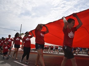 What’s a Canada Day parade without a Canada-size Canada Flag. This one was held aloft by a team from the WFCU Credit Union along the parade route which ran along Wyandotte Street East from Devonshire to Aylmer.