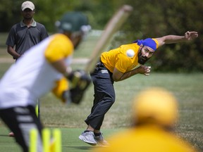 Harjeet Singh, from the St. Clair College downtown campus, bowls to the batter during the first day of the Cross Campus Cricket Cup at Jackson Park, on Tuesday, July 5, 2022.