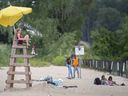Lifeguard on duty, warning signs posted, fencing set up for off-limits swim area — Sand Point Beach on Monday, July 11, 2022, had plenty of good precautions in place for safer public swimming.