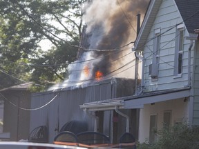Flames visible on the roof of a building at 495 Tuscarora St. in Windsor on July 14, 2022.