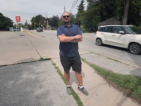 Tecumseh resident and activist Wes Bechard stands on Riverside Drive east of Lesperance Road - where the extension of the Ganatchio Trail is meant to begin. Photographed July 28, 2022.