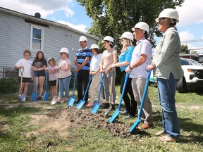 Habitat for Humanity Windsor-Essex held a ground breaking ceremony on Tuesday, July 26, 2022 for their new build site on Henry Ford Centre Drive in Windsor. Families who will move into the homes, administrators and board members are shown during the event.