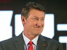 Former NHL hockey player Wayne Gretzky smiles during a promotional event for the Beijing Kunlun Red Star hockey team in Beijing, Thursday, Sept. 13, 2018. Gretzky has become a minority owner in the Ontario Hockey League's Niagara IceDogs.