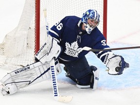 Toronto Maple Leafs goalie Jack Campbell (36) makes a glove save against the Tampa Bay Lightning in game seven of the first round of the 2022 Stanley Cup Playoffs at Scotiabank Arena.
