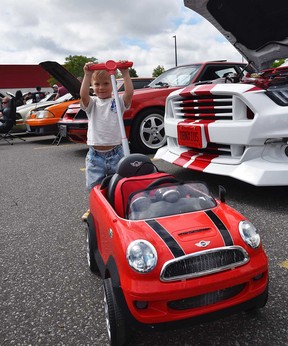 Two-year-old Jack Fraley joins in the car worship at the Hot Wheels Legends Tour stop in Windsor on July 16, 2022.