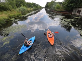 Jaclyn Stroud and her daughter Zoe kayak on the Little River on a sunny and warm Monday, July 18, 2022.