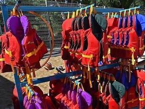 A collection of life jackets - including child-sized ones - is shown in this file photo.