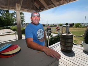 Mike McQueen is shown on July 5, 2022, at his Leamington waterfront property, the subject of a dispute with the municipality.
