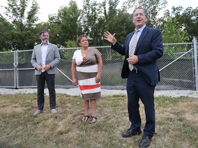 Windsor Coun. Kieran Mckenzie, left,  Chief Mary Duckworth of Caldwell First Nation and MP Brian Masse are shown during a press conference at the Ojibway Shores in Windsor on Wednesday, July 20, 2022.