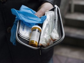 Garth Mullins holds a Naloxone anti-overdose kit in downtown Vancouver, Feb. 10, 2017.