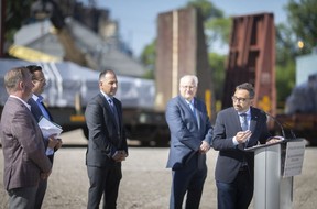 Easing supply chain pressures. Federal Transport Minister Omar Alghabra, right, announces $5 million in federal assistance for new Port of Windsor warehouse facilities as local dignitaries on Tuesday look on.