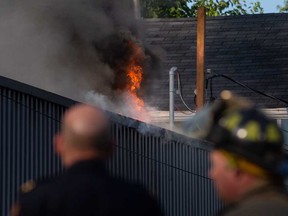 Flames visible on on the roof of a structure at 495 Tuscarora St. in Windsor on July 14, 2022.