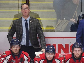 Windsor Spitfires' assistant coach Andy Delmore, left, remained hospitalized on Tuesday awaiting tests results after suffering a medical emergency at practice on Monday.