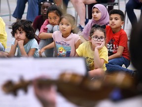 Summer campers watch a performance by the Windsor Symphony Orchestra's youth program ensemble at West Gate Public School in Windsor on Friday, July 22, 2022.