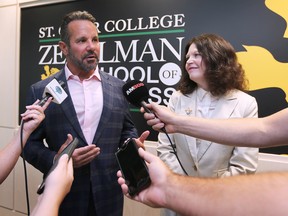 The Zekelman Centre of Business and Information Technology at St. Clair College was officially opened on Wednesday, July 27, 2022. Barry Zekelman, CEO of Zekelman Industries, left, and college president Patti France speak to reporters during the event.
